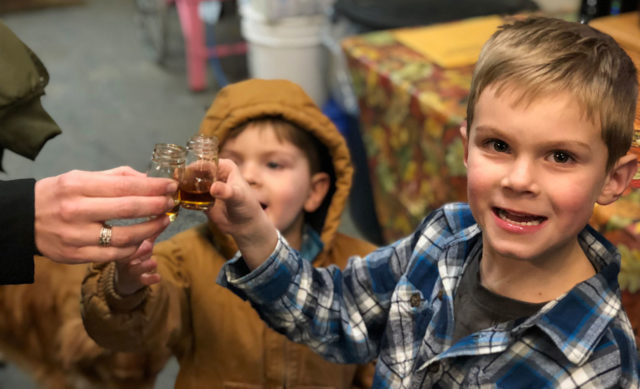kids tasting maple syrup
