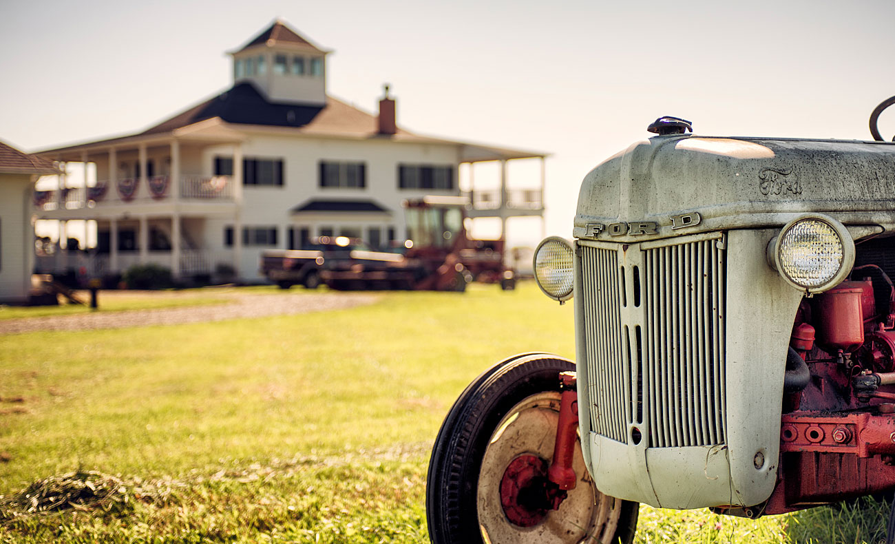 Old tractor parked at farm